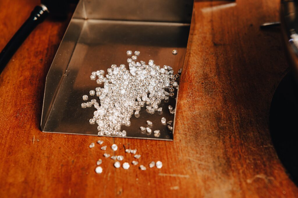 Lots of small diamonds in a metal tray