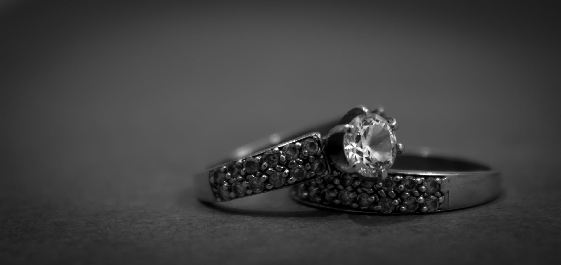 A close-up shot of a metal engagement ring